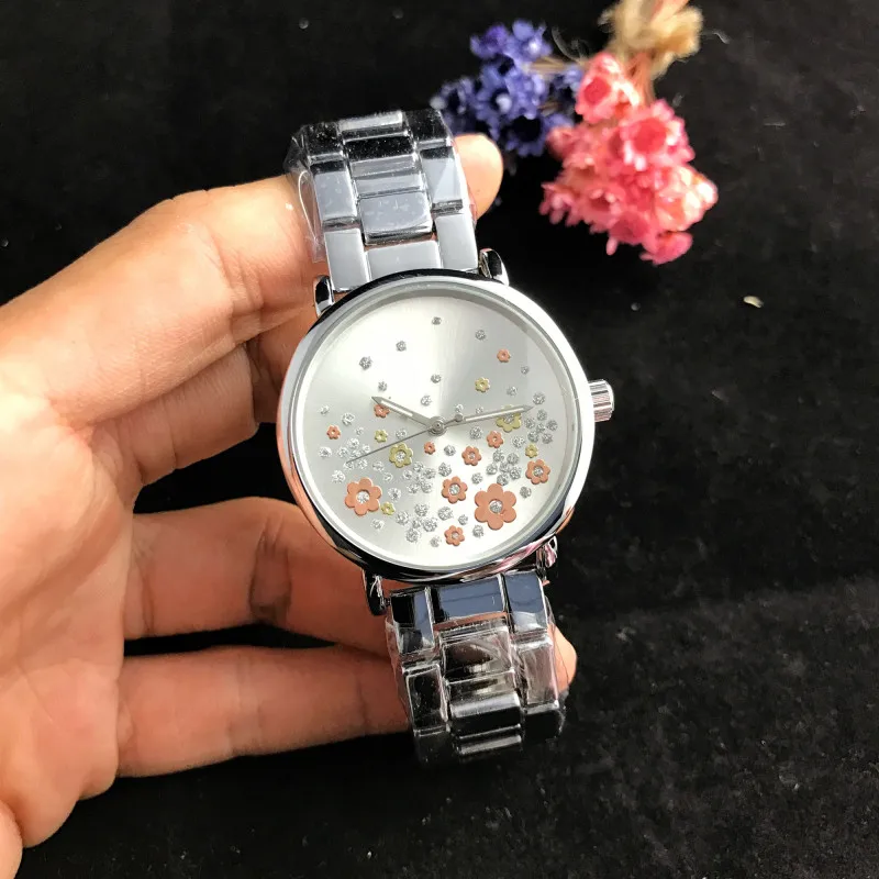 

Fashionable ladies quartz watch, colorful flower dial and brand logo.M-