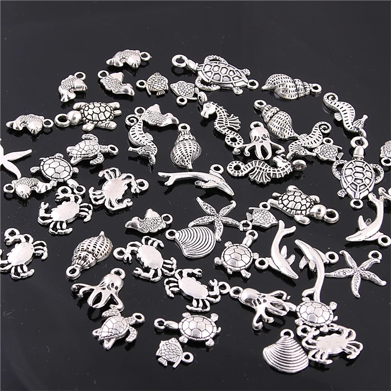 

Sweet Bell 60PCS Mixed Antique silver mini Ocean Dolphin Shell Charms Pendant Jewelry Making Diy Charm Handmade Crafts H3003