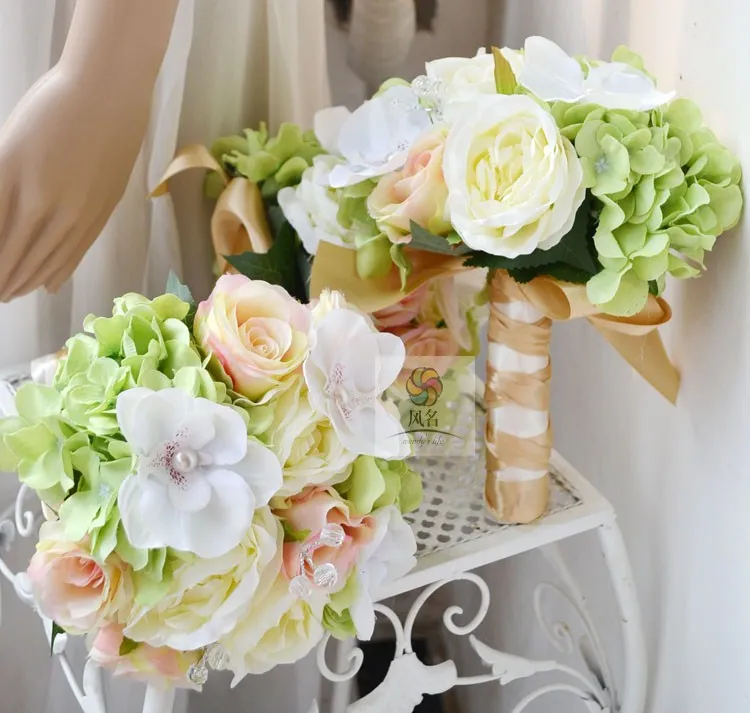 

Handmade wedding flower bride holding flowers green and white powder rose hydrangea orchid