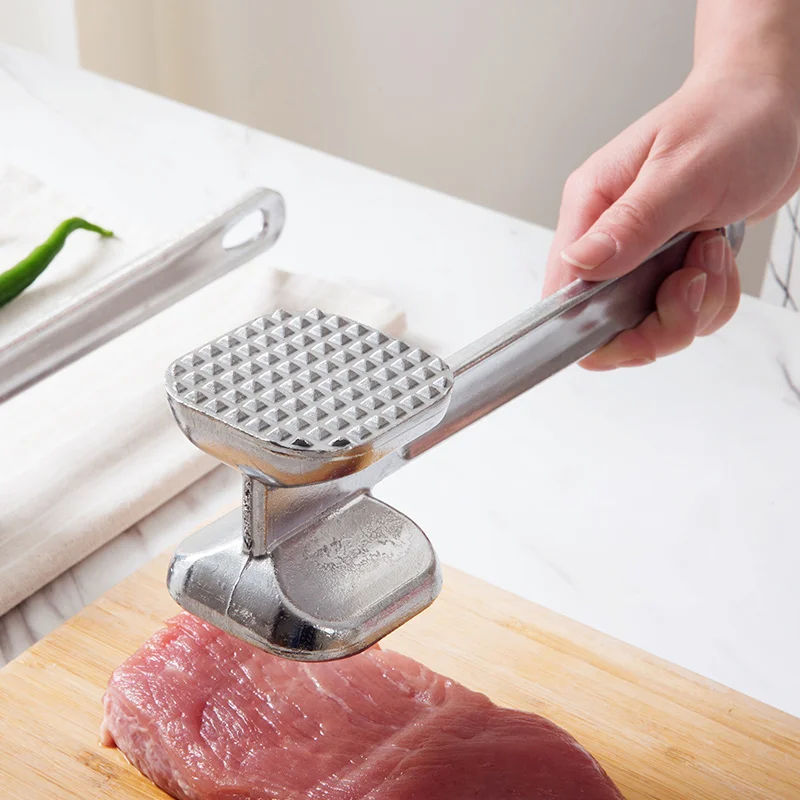 

A hammer for beating a large row of loose meat and hammering pork chops