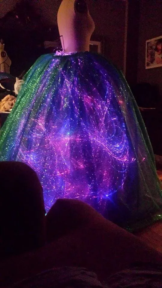 It was all 6 ft fiber optic lights hand sewn into the dress itself!