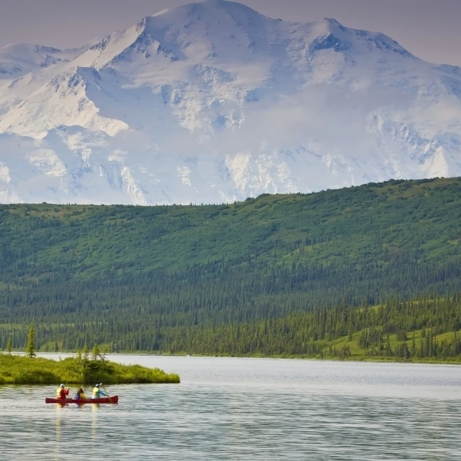 Three People In One Canoe On Wonder Lake With Mt. Mckinley In Background In