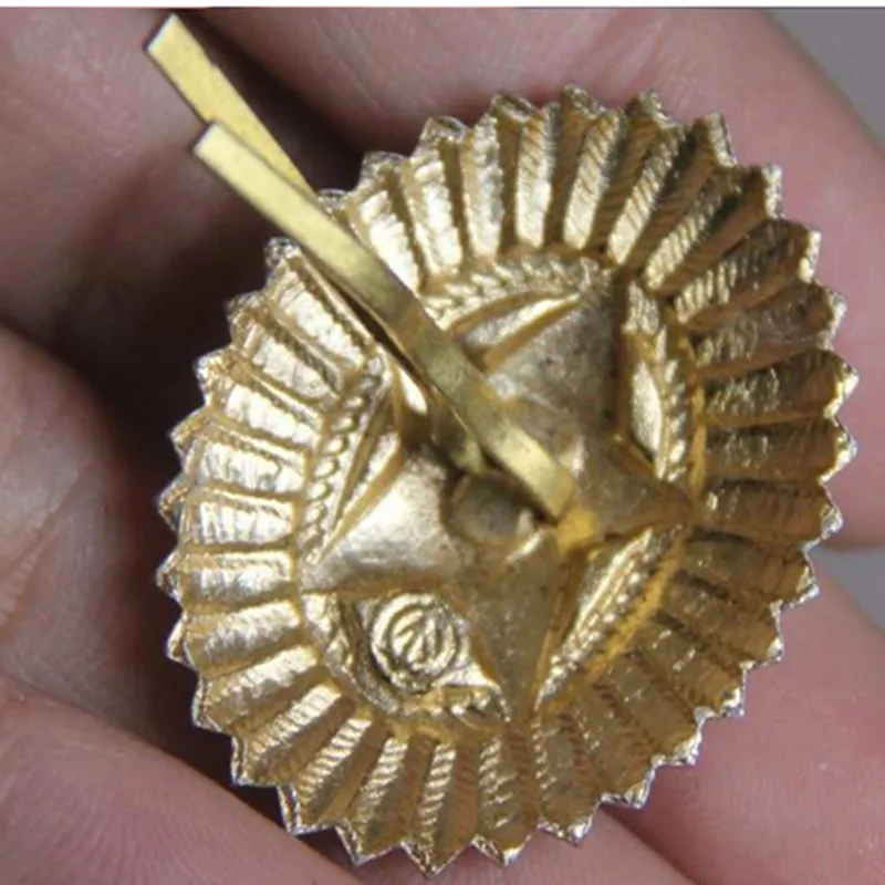 cap badge back