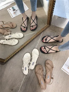 

Summer Roman style new cross strap sandals Korean version of the wild beach sandals.