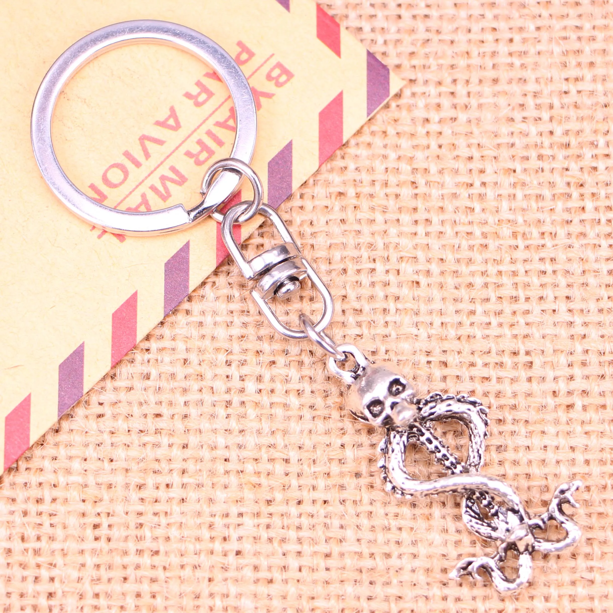 

20pcs New Fashion Keychain 37x20mm skull skeleton wand Pendants DIY Men Jewelry Car Key Chain Ring Holder Souvenir For Gift