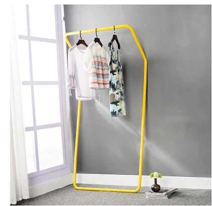 Display stand. Colorful floor against the wall. Hanger. Clothing. Clothes tree.