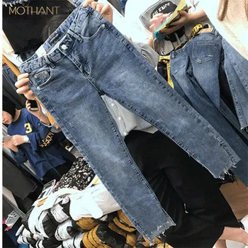 

The new Korean version of the large size jeans female fat mm high waist elastic thin hole straight pants nine cent pants