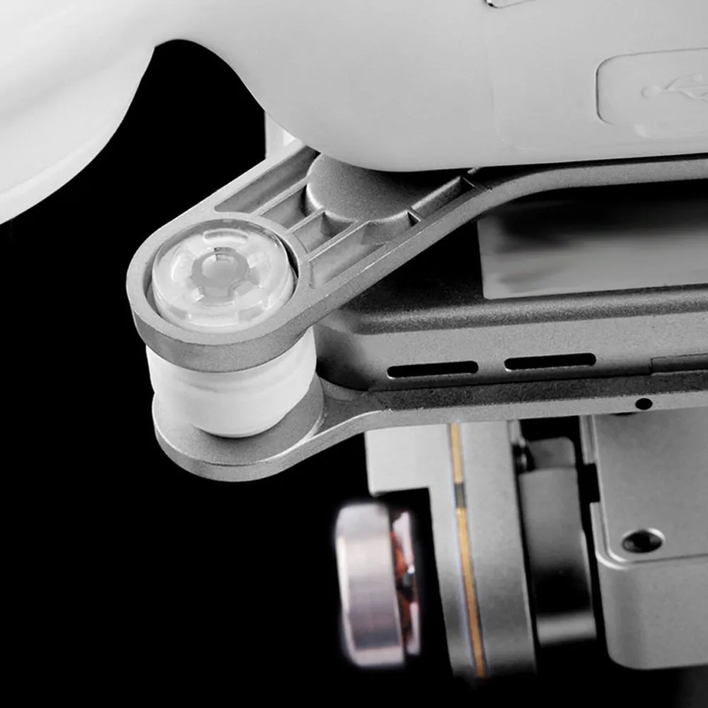 Kit amortisseurs complet posé à côté d'un drone Dji Phantom 3, avec boules et broches visibles