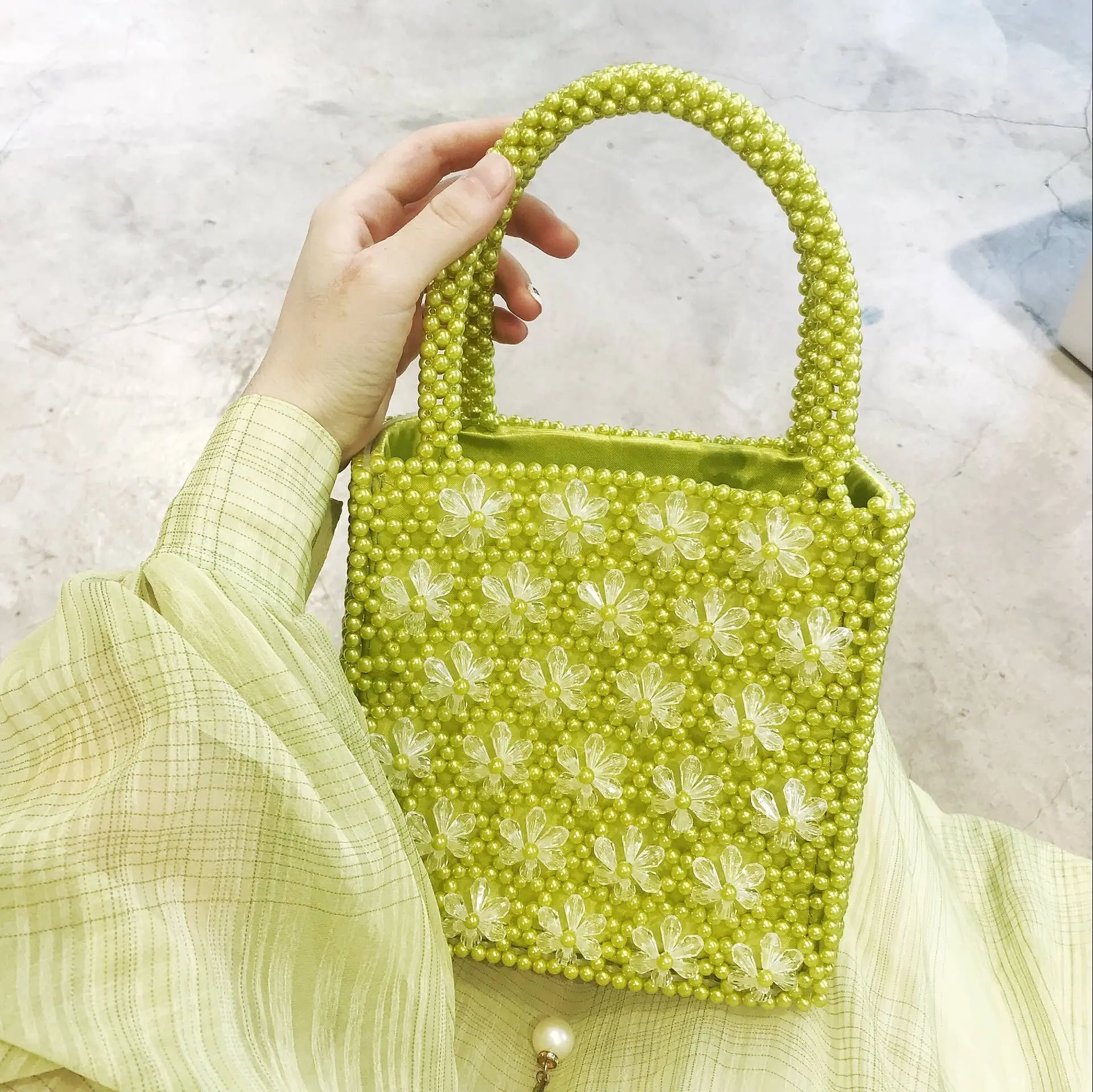 

2019 women spring new niche design with the bag pearl handbag bead woven hand bag
