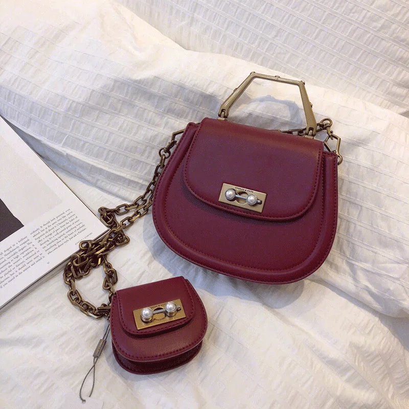 

2019 new female shoulder bag PU leather saddle messenger bag letter pearl parent-child package pig limited handbag