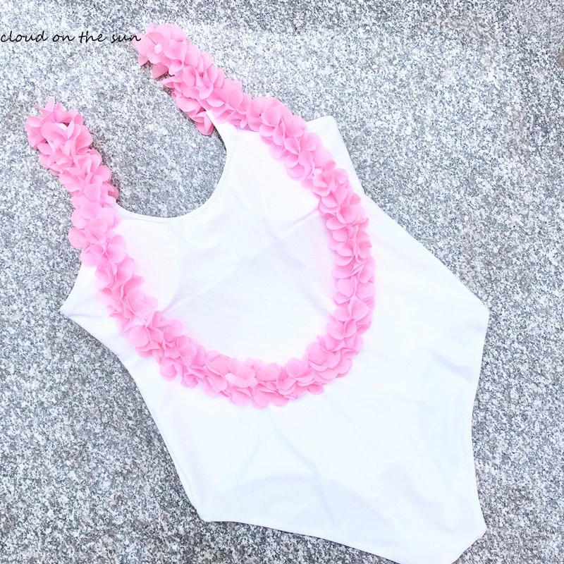 white bathing suit with flowers