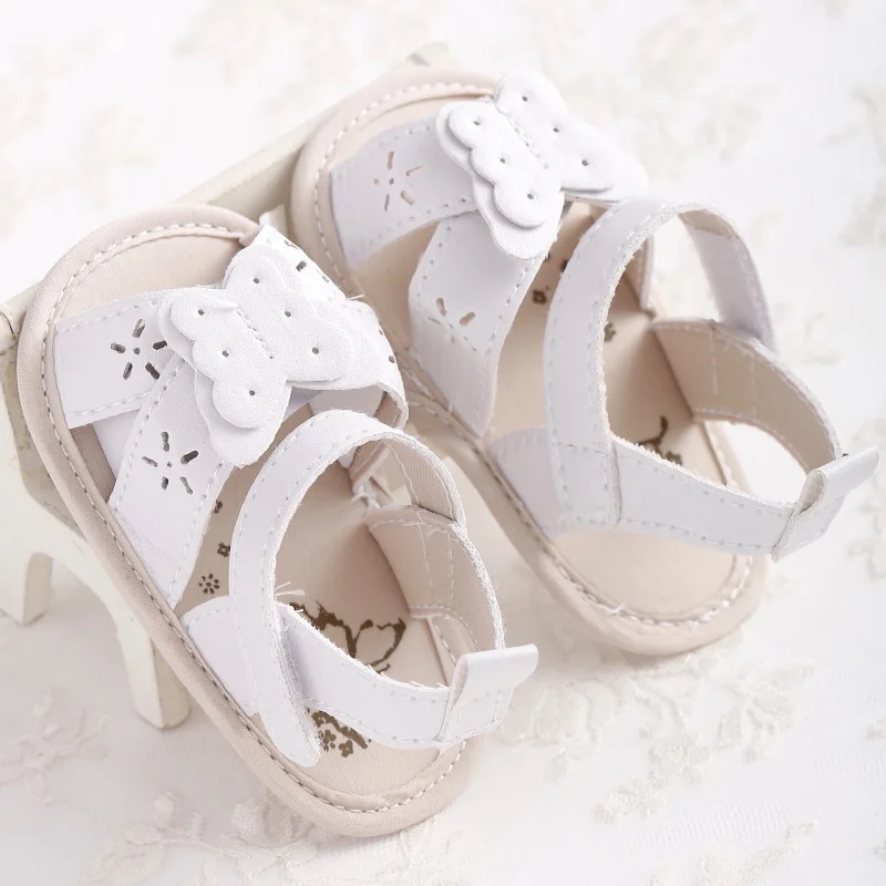 white newborn sandals