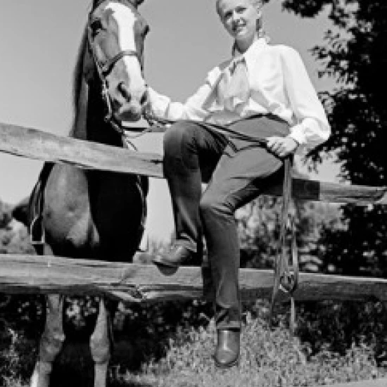 Young woman and horse on farm Poster Print (18 x 24)