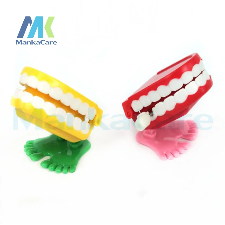 

20 Pcs Children's toys on the chain clockwork Halloween / Easter jumping white teeth On the chain jumping teeth Dental Preferred