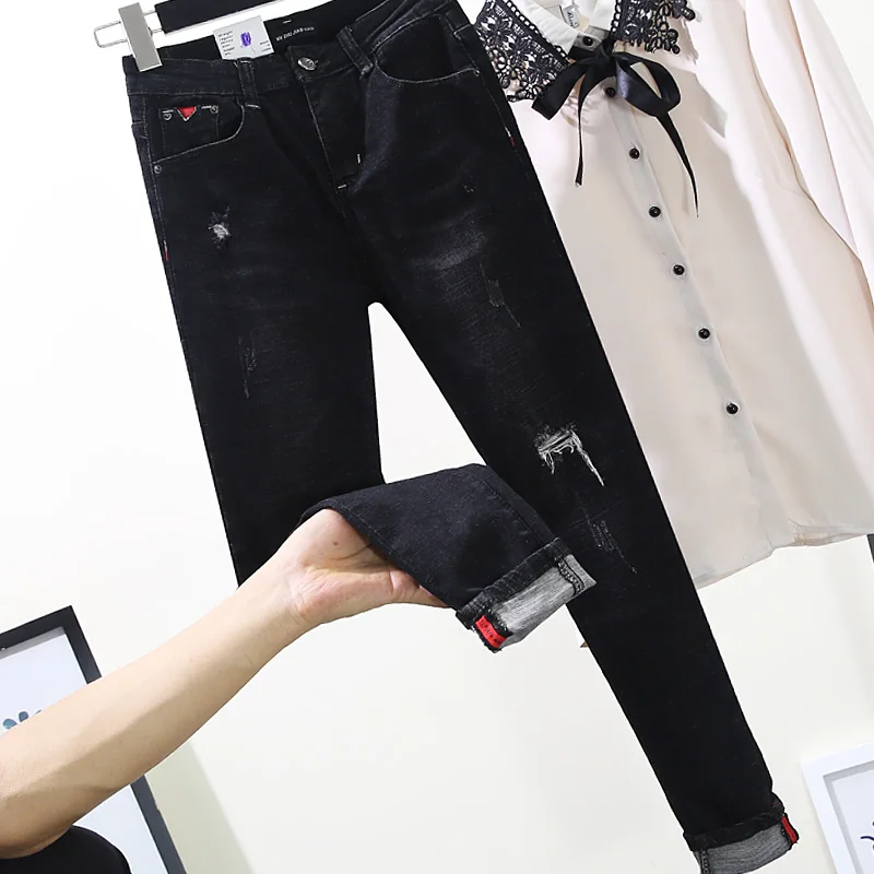 

New high waist, false hole, jeans, nine points, version, elastic knees, holes, little legs, pencil pants, girls.