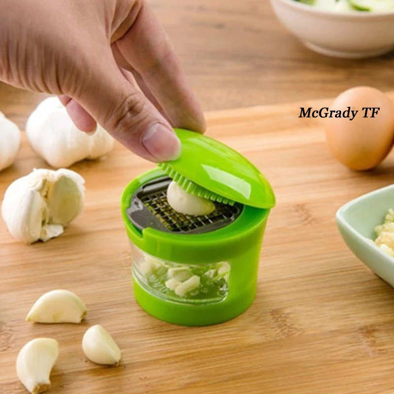 

Hot Practical Home Kitchen Tool Garlic Press Sharp Stainless Steel Blades Inbuilt Clear Plastic Tray Hand Presser Garlic Grinder
