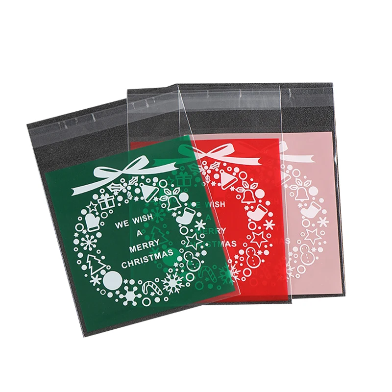

100pcs/pack High Quality Christmas Santa Plastic Gift Bags Christmas Cookies /Candy Packaging New Year Decoration
