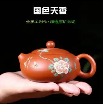 

2018 new style The famous Yixing teapot Zhu Niqiu ore hand hole flat pot 190cc national beauty and heavenly fragrance beauty