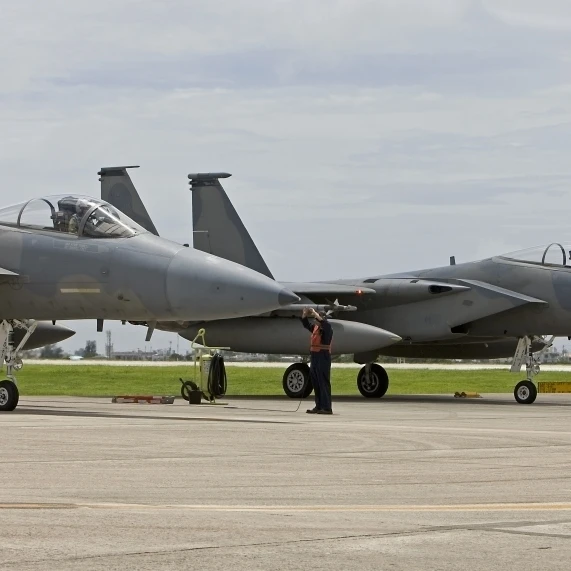 Two F-15's parked at the end of runway at Kadena Air Base  Japan Poster Print (18 x 10)