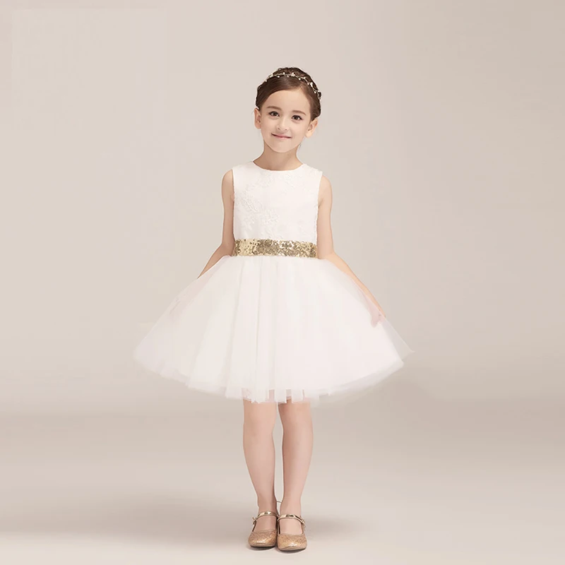 white flower girl dress with gold sash