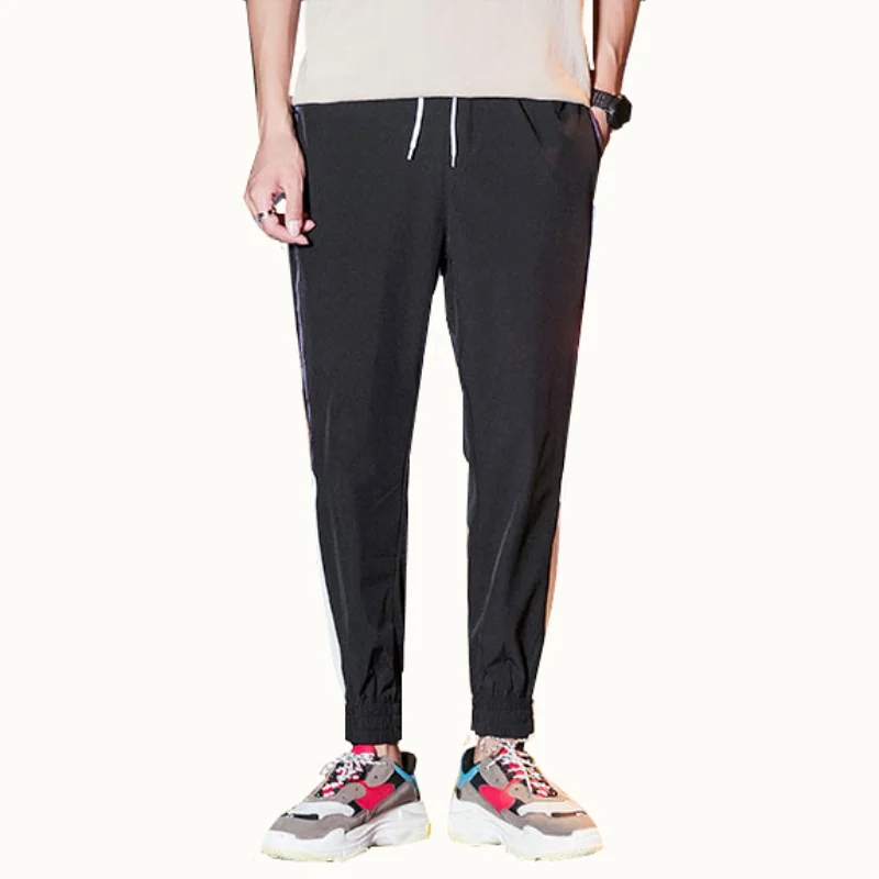 

Men's trousers New spring-selling casual stitching harem pants Men's fashion hit color slimming large size sweatpants joggers