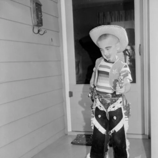 Boy wearing cowboy costume Poster Print (24 x 36)