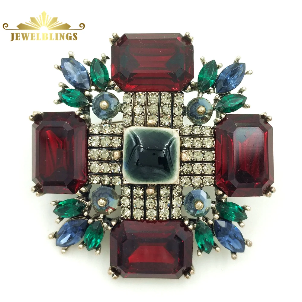 

Designer Vintage Green and Red Maltese Cross Pins Brooches Gold Tone Pave Clear Crystal Marquise Shaped Leaf Deco Cross Broaches