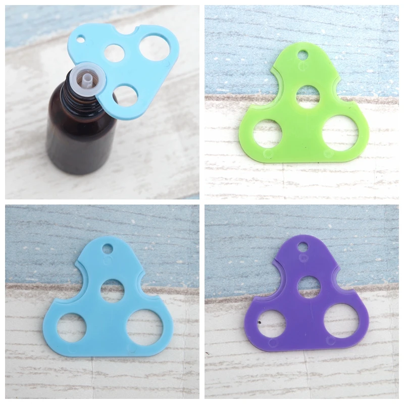 

Mix Color Mix Shape Essential Oil Key Tool Universal Opener Remover for Roller Balls and Caps on Most Bottles 10 pcs/lot P117