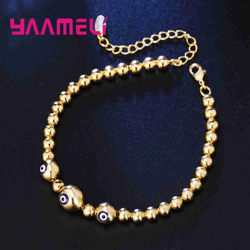 Silver Bangle with Gold Color Beads