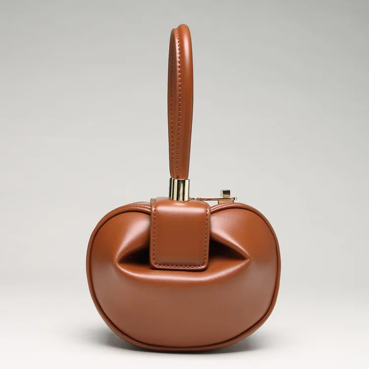 

Europe and the United States fashion ladies retro jingle dumplings-style bag personality unique leather lock female bag