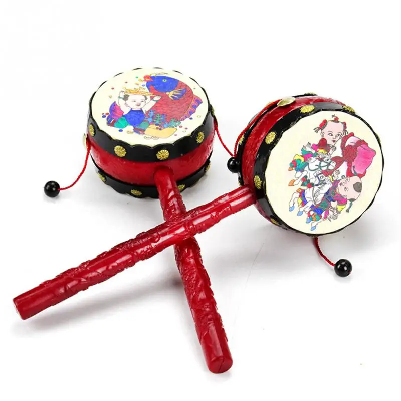 Bébé enfants dessin animé en plastique chinois traditionnel hochet tambour Spin fun jouets main cloche musique jouets