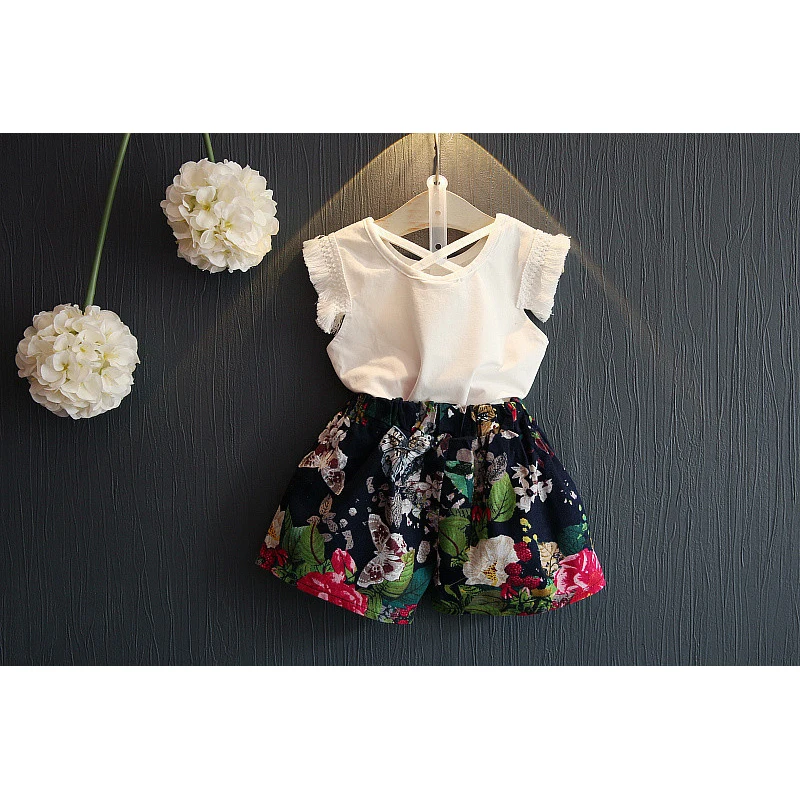 Anlencool الفتيات ملابس الصيف نمط فتاة مجموعة ملابس بلا أكمام شرابة الأبيض T-قميص + الزهور طباعة السراويل 2 Pcs الدعاوى