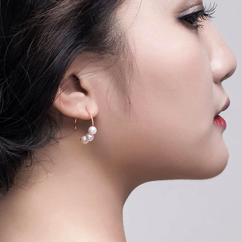 Rose gold hook pearl earrings model show