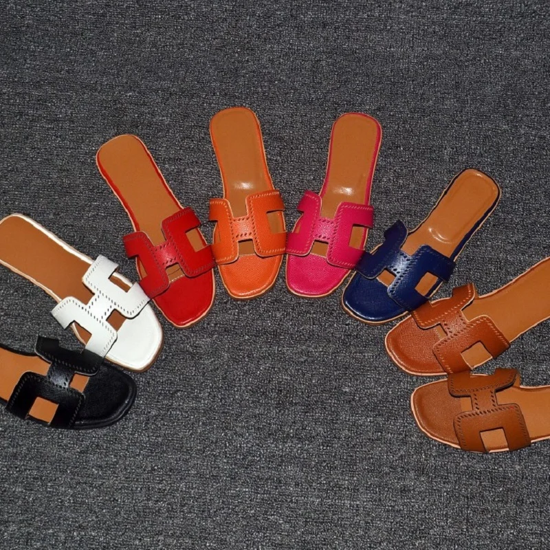 

2018 new leather hollow H slippers fashion wear flat word cool slippers female summer beach large size sandals