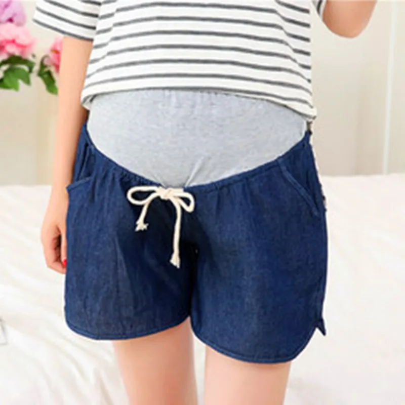 

Pregnant women with abdominal thin relaxed denim shorts. Pregnant women wear jeans down. Maternity. Free shipping