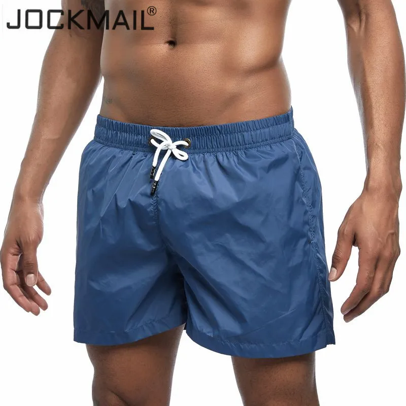 

JOCKMAIL Men's Board Shorts Qucik Dry Beach shorts Summer Surf Swimming Trunks Male Athletic Swimwear Running Gym Shorts men
