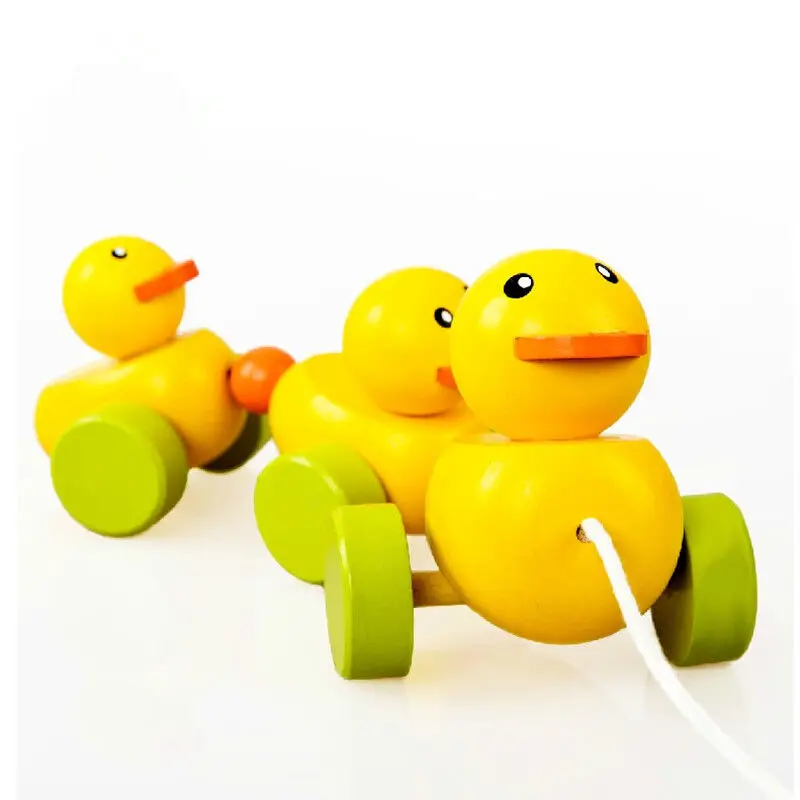

Free shipping Baby wooden yellow duck trailer, Children educational toys Drag the toy exercise baby crawl and walk
