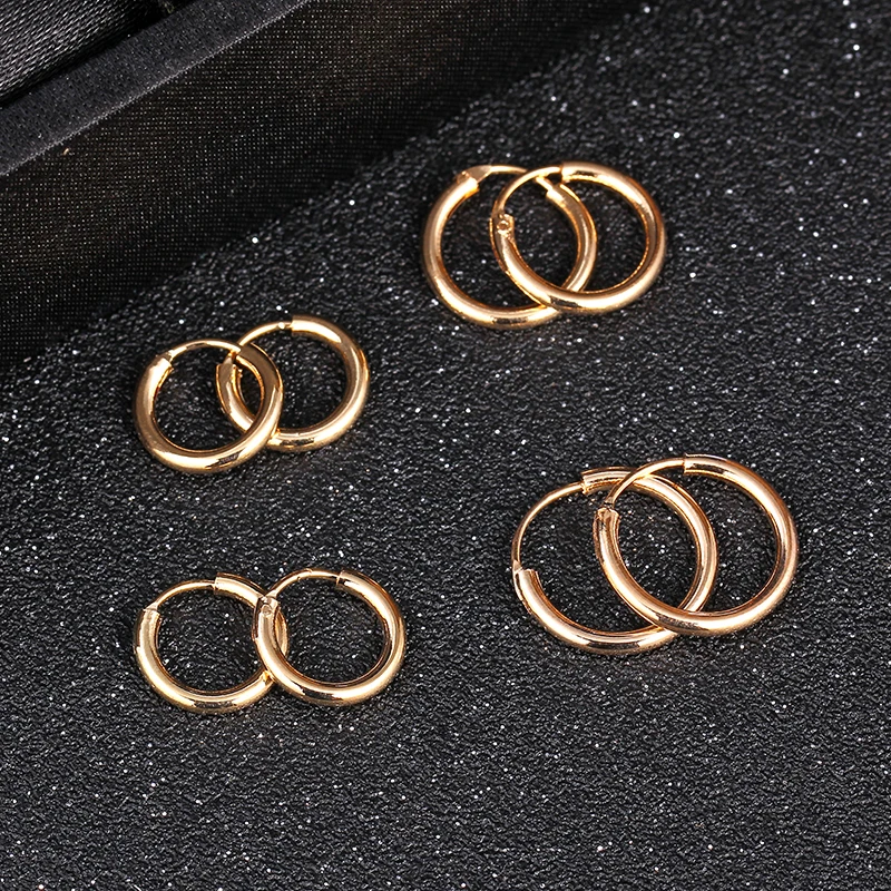 

A pair of gold GD with the Korean version of the round earrings earrings couples men and women earrings wholesale