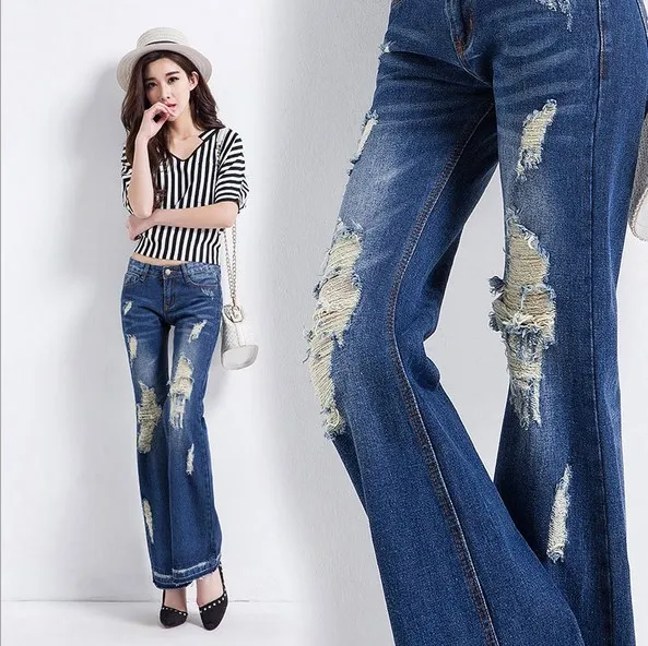 calça jeans rasgada na perna