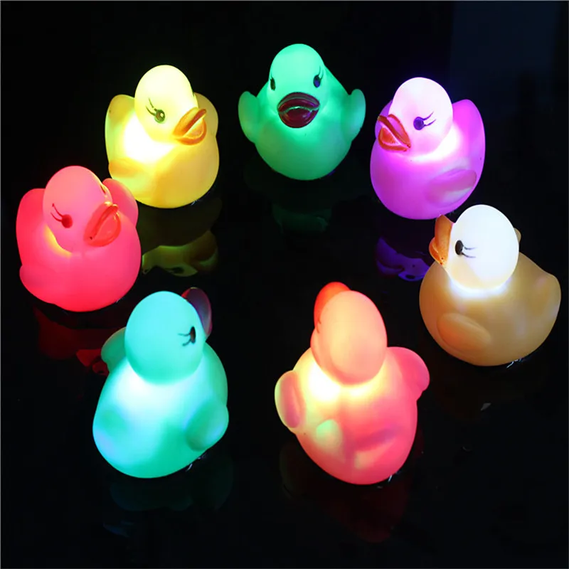 

Quadruple 1 pc LED Rubber Duck Flashing Light Bath Toys Water Induction Illuminate Swimming Duck Novelty Children Light Toys