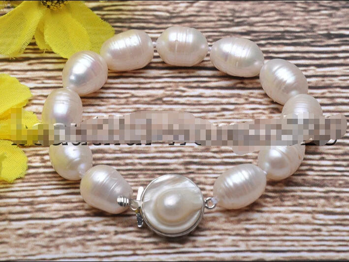

Free shipping >>>>>>Z7434 natural 16mm Rice screw White Freshwater Pearl bracelet 8inch