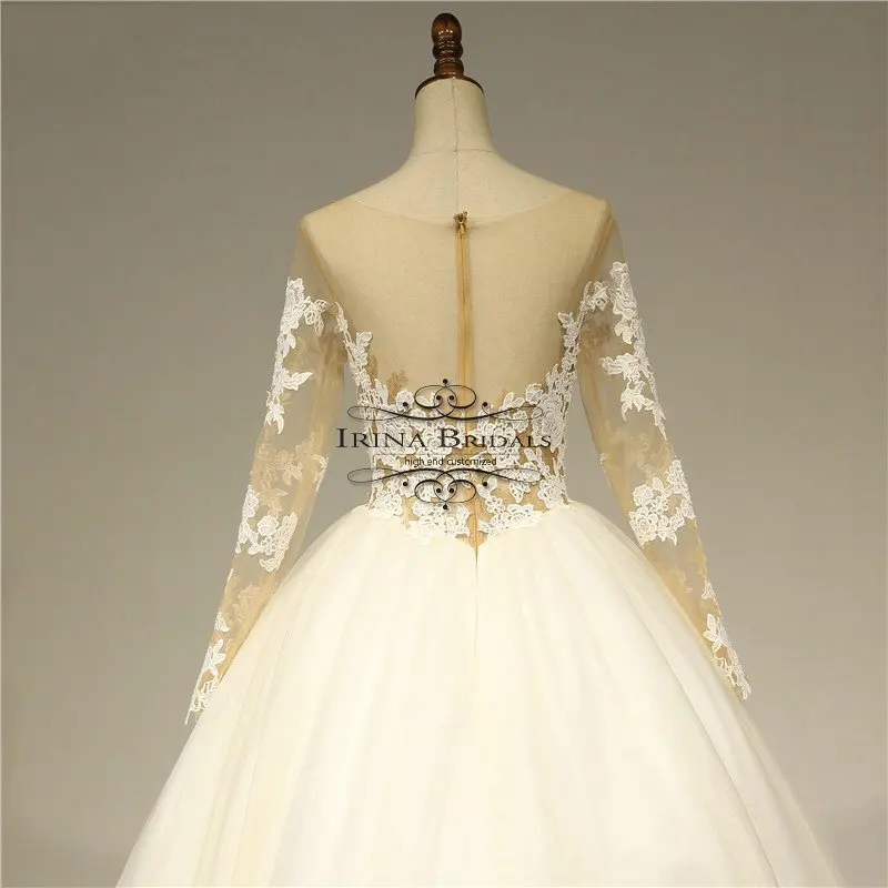 Свадебное платье с длинными рукавами и кружевной аппликацией Irina Bridals