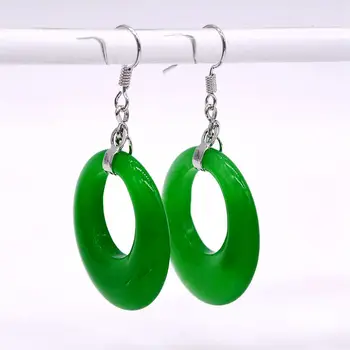 

Classic hoop earrings. Exaggerated ladies sterling silver earrings. National style. Green stones. Women's earrings