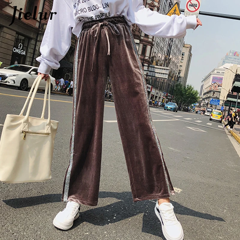 black trousers with silver side stripe