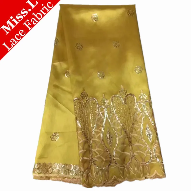 

New Arrival high quality lace fabric with sequins in yellow!New african raw silk george lace fabric for nigeria wedding dress