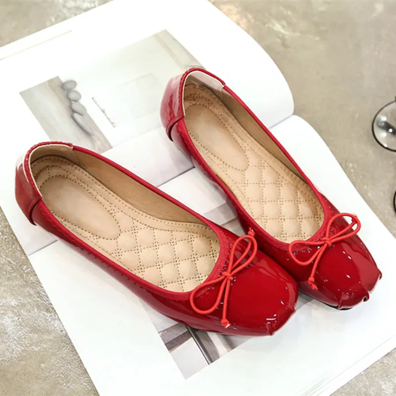 red flat shoes with bow