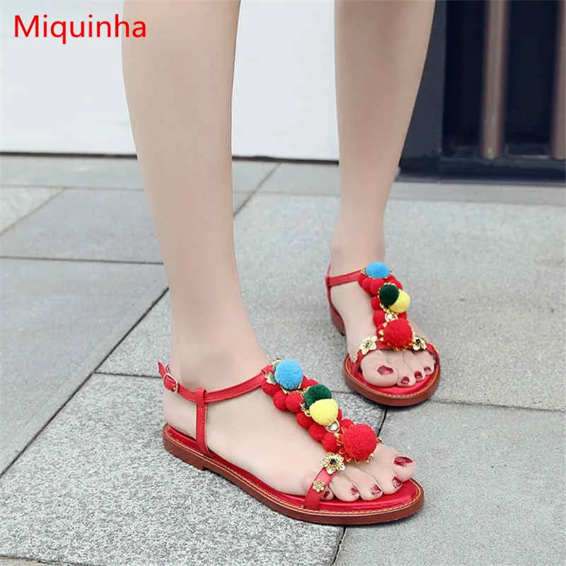 

Miquinha Open Toe Buckle Flat Metal Flower Colored Fur Ball Embellished Leather Women Sandals Bohemian National Wind Women Shoes