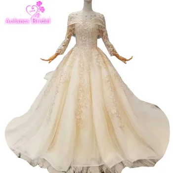 

2018 Champagne Tulle Lace Applique Scoop Court Train Long Sleeves Bridal Gown Floor-length Ball Gown Illusion Wedding Dresses