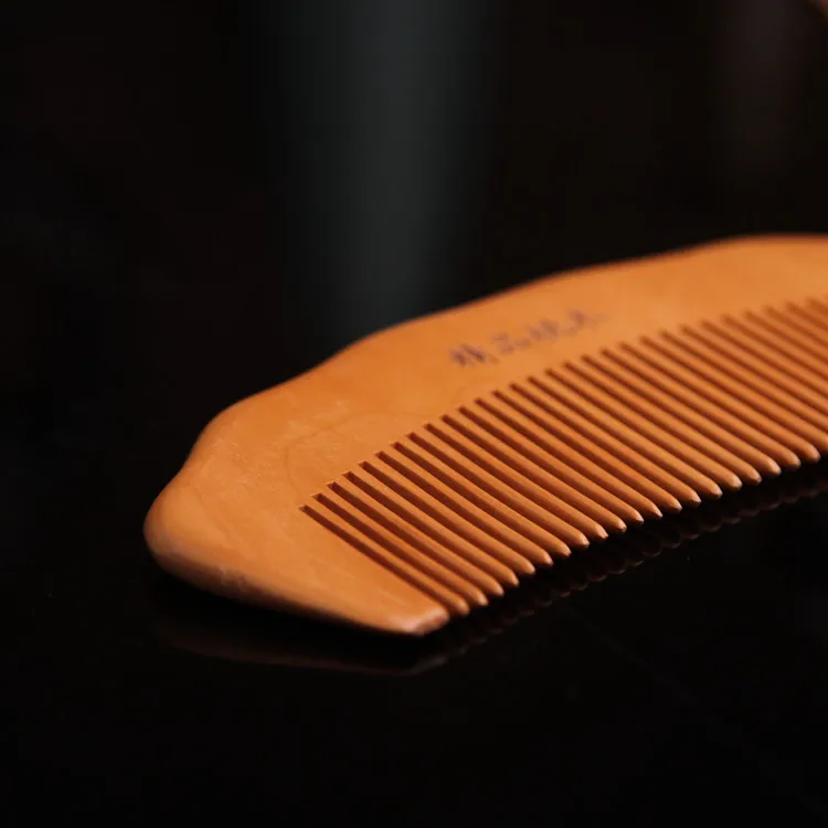 

NAPSE C03 Carving small mahogany comb Anti-static portable solid wood comb