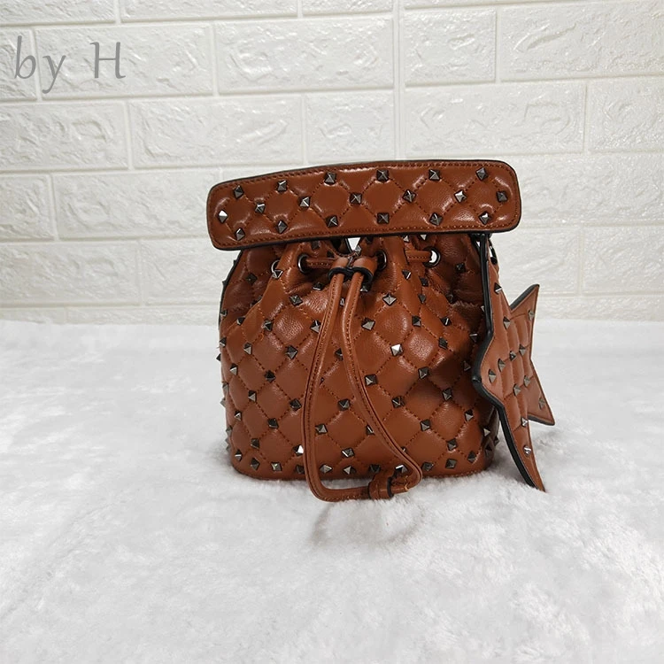 

by H 2019 new women's bucket bag sheep skin black rivet shoulder bag star deco luxury designer bolsa high quality messenger bag